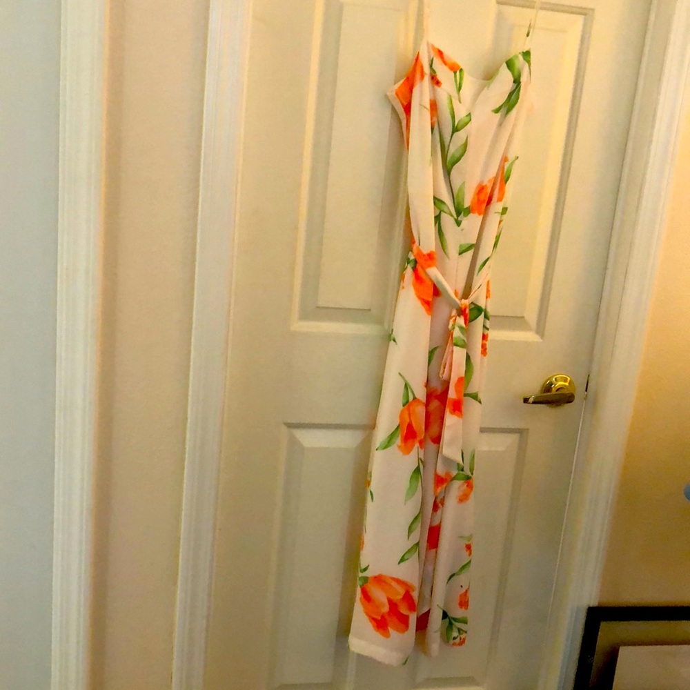 NWOT. White House Black Market Size 8 Strapped Jumpsuit.  Excellent Condition.